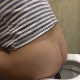 A girl takes a shit while sitting on a toilet in at least 6 scenes. Very clear farting, crackling, and loud plops. Some poop action is visible from the side or rear. Presented in 720P HD. 118MB, MP4 file. About 10 minutes.